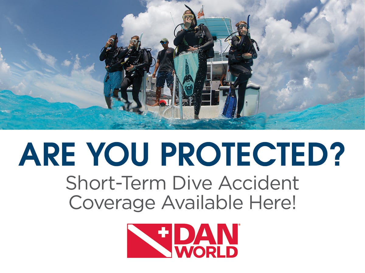 Scuba divers entering the water