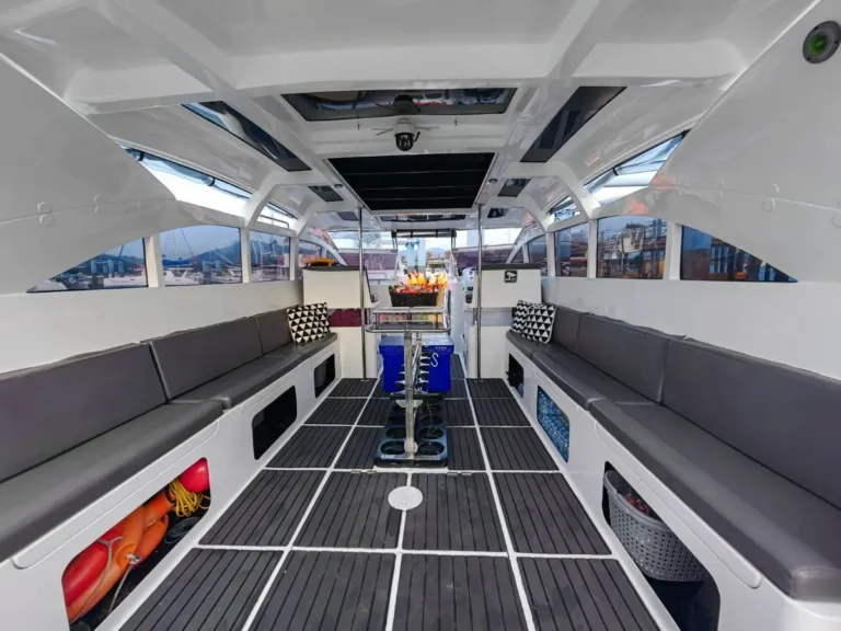 Covered sofa seating and dive tank storage aboard the private speedboat